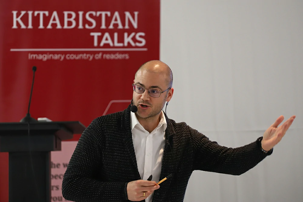 Professor Sean Mueller giving lecture at Kitabistan Talk. Education in Switzerland and Swiss Democracy.