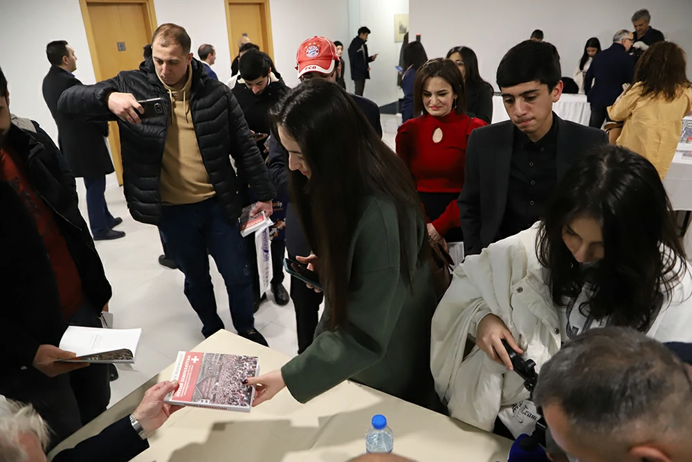 Book signing after Kitabistan Talk. Education in Switzerland and Swiss Democracy.